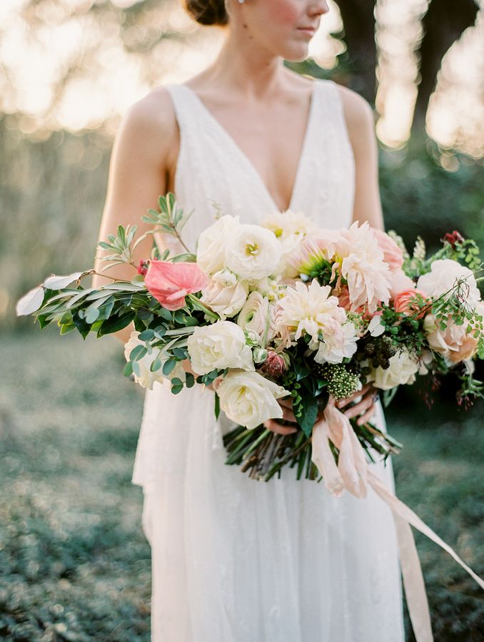 Bride holding a blush and ivory bouquet